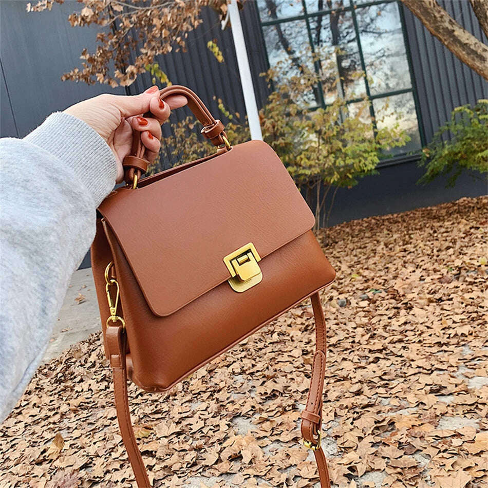 Chic Leather Top-Handle Bag with Gold Lock Closure