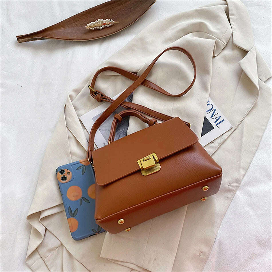 Chic Leather Top-Handle Bag with Gold Lock Closure