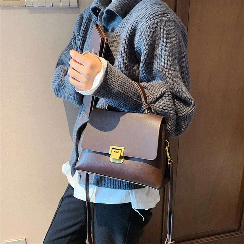 Chic Leather Top-Handle Bag with Gold Lock Closure