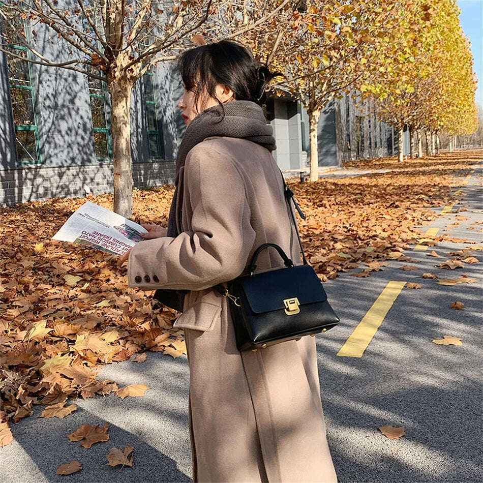 Chic Leather Top-Handle Bag with Gold Lock Closure