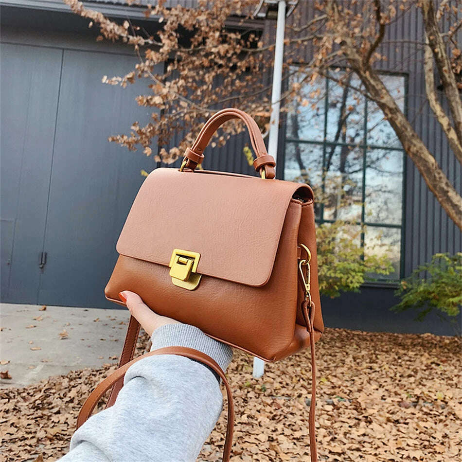 Chic Leather Top-Handle Bag with Gold Lock Closure