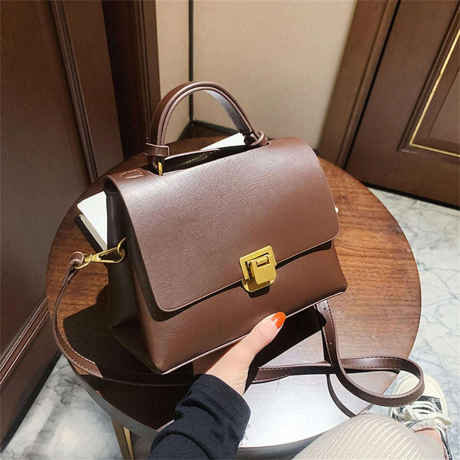 Chic Leather Top-Handle Bag with Gold Lock Closure