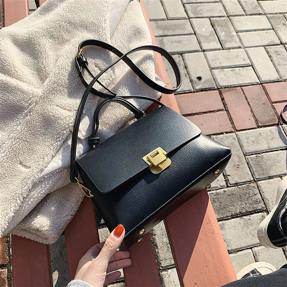 Chic Leather Top-Handle Bag with Gold Lock Closure