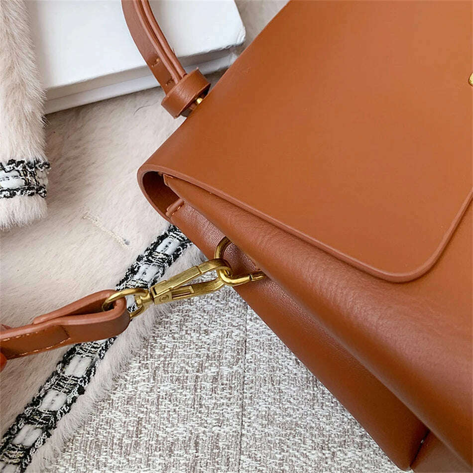 Chic Leather Top-Handle Bag with Gold Lock Closure