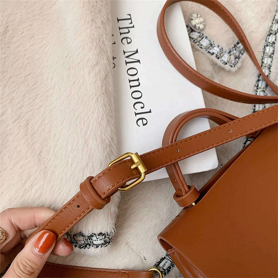 Chic Leather Top-Handle Bag with Gold Lock Closure