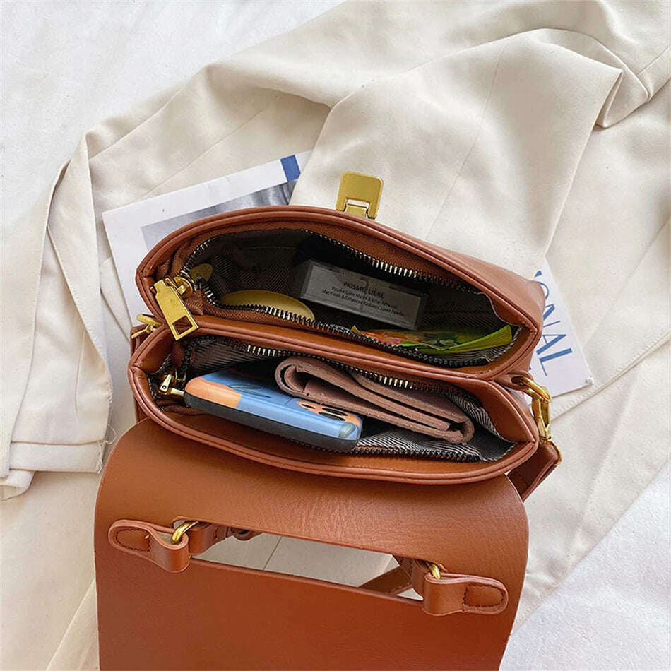 Chic Leather Top-Handle Bag with Gold Lock Closure