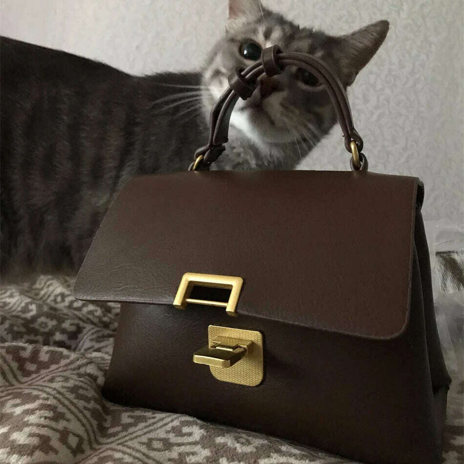 Chic Leather Top-Handle Bag with Gold Lock Closure