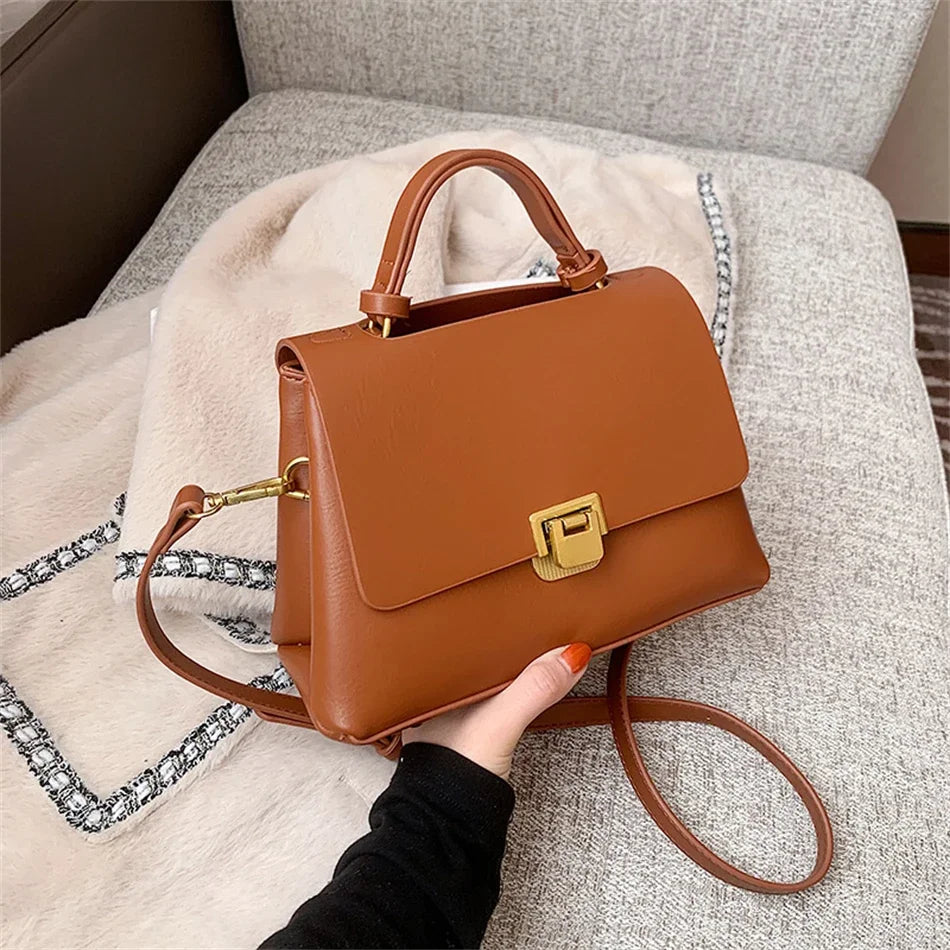Chic Leather Top-Handle Bag with Gold Lock Closure