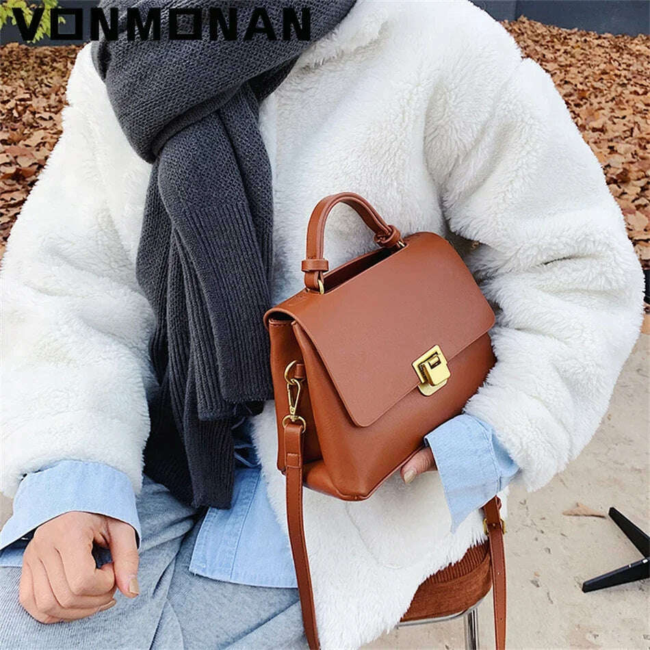 Chic Leather Top-Handle Bag with Gold Lock Closure