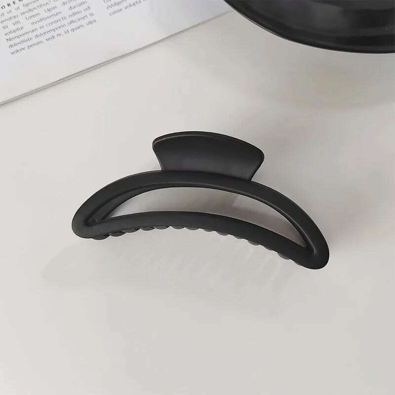 Elegant Black Geometric Hair Claw.