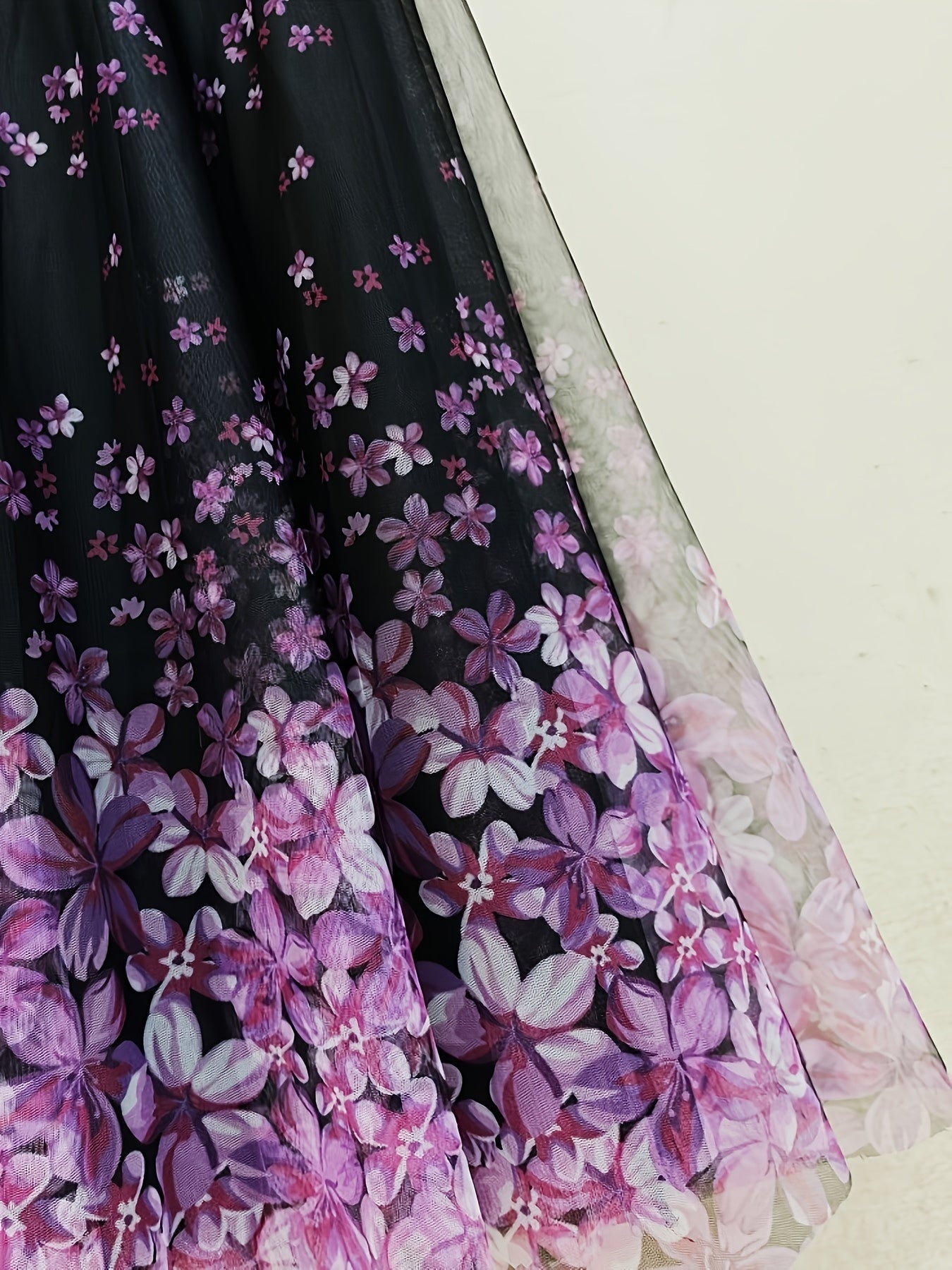 A Long Skirt That Flatters The Figure, Concealing Imperfections, Made of High-Quality Three-Layer Mesh Fabric with Floral Prints, Featuring a High Waist And a Flared Design.