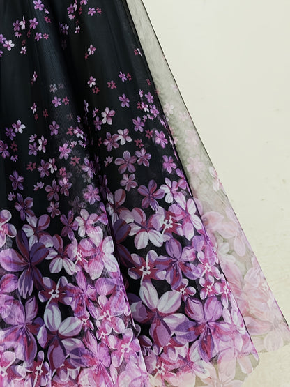 A Long Skirt That Flatters The Figure, Concealing Imperfections, Made of High-Quality Three-Layer Mesh Fabric with Floral Prints, Featuring a High Waist And a Flared Design.