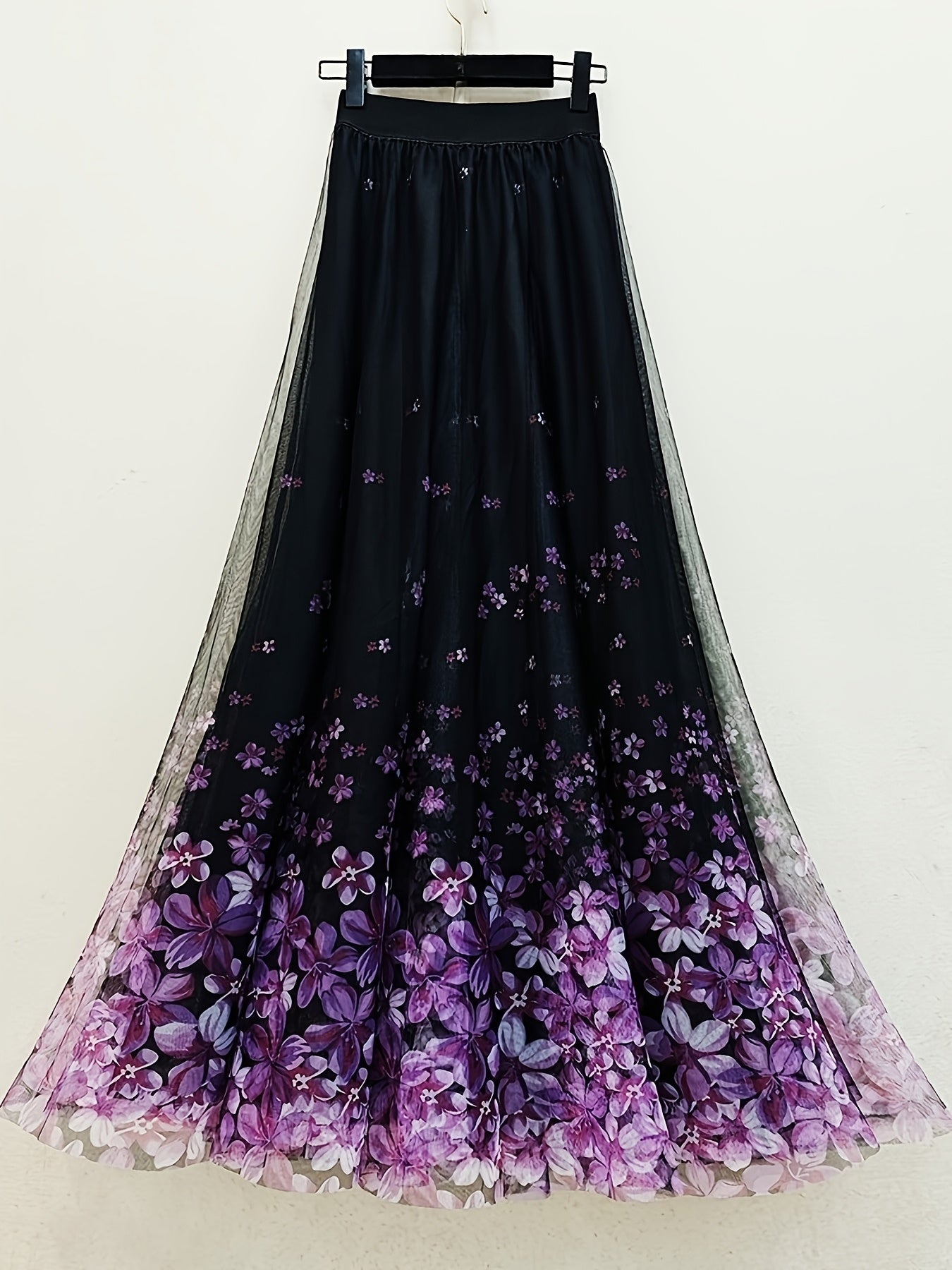 A Long Skirt That Flatters The Figure, Concealing Imperfections, Made of High-Quality Three-Layer Mesh Fabric with Floral Prints, Featuring a High Waist And a Flared Design.