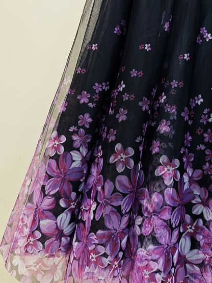A Long Skirt That Flatters The Figure, Concealing Imperfections, Made of High-Quality Three-Layer Mesh Fabric with Floral Prints, Featuring a High Waist And a Flared Design.