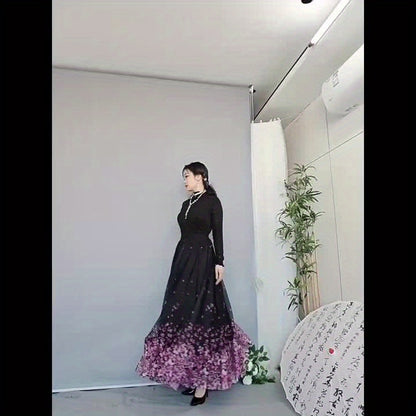 A Long Skirt That Flatters The Figure, Concealing Imperfections, Made of High-Quality Three-Layer Mesh Fabric with Floral Prints, Featuring a High Waist And a Flared Design.